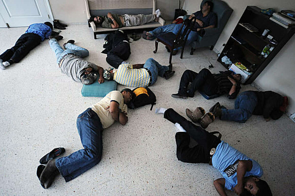 Supporters of ousted Honduran President Manuel Zelaya sleep at a room contiguous to his, at the Brazilian Embassy in Tegucigalpa, on September 25, 2009. Honduras' de facto leader and ousted President Manuel Zelaya have agreed to start dialogue, in a first break of a tense political impasse here since Zelaya's surprise return home five days ago. Zelaya, who is holed up in the Brazilian embassy, said a dialogue had begun with the de facto government to seek a peaceful end to the crisis set off by his June 28 ousting.