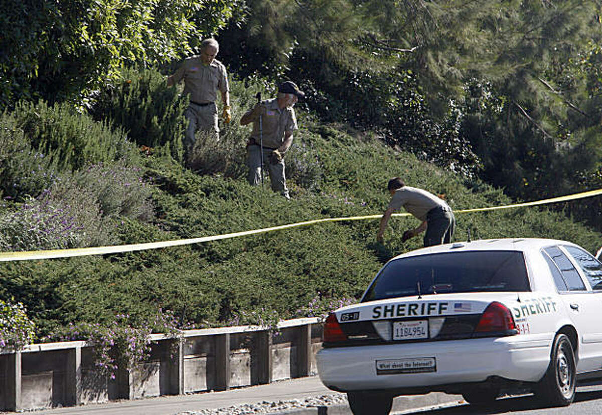 The Marin Sheriff department search the front yard of a private home in the 600 block of Hilary Drive in Tiburon Calif., for any clues that might help them in homicide of a woman in her 70s that was found shot to death today outside her home on September 22, 2009.