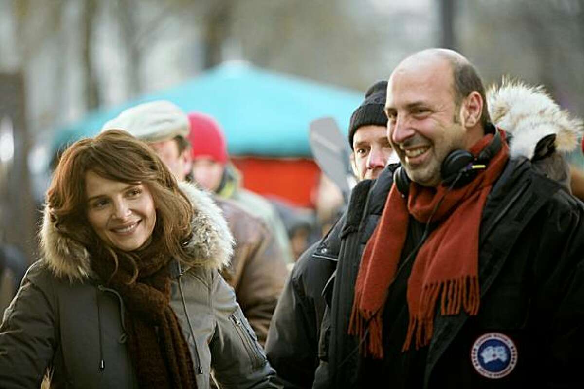 Actress Juliette Binoche and director Cedric Klapisch on the set of their 2009 film, "Paris."