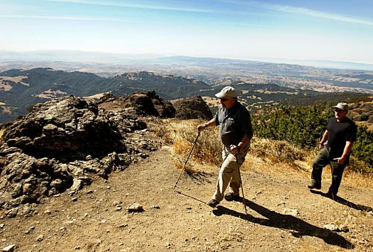 Ron Brown (left) and Seth Adams, of the Save Mount Diablo organization, walk through the newly acquired Viera-North Peak parcel of land in Mount Diablo State Park, Calif., on Thursday, Sept. 10, 2009.