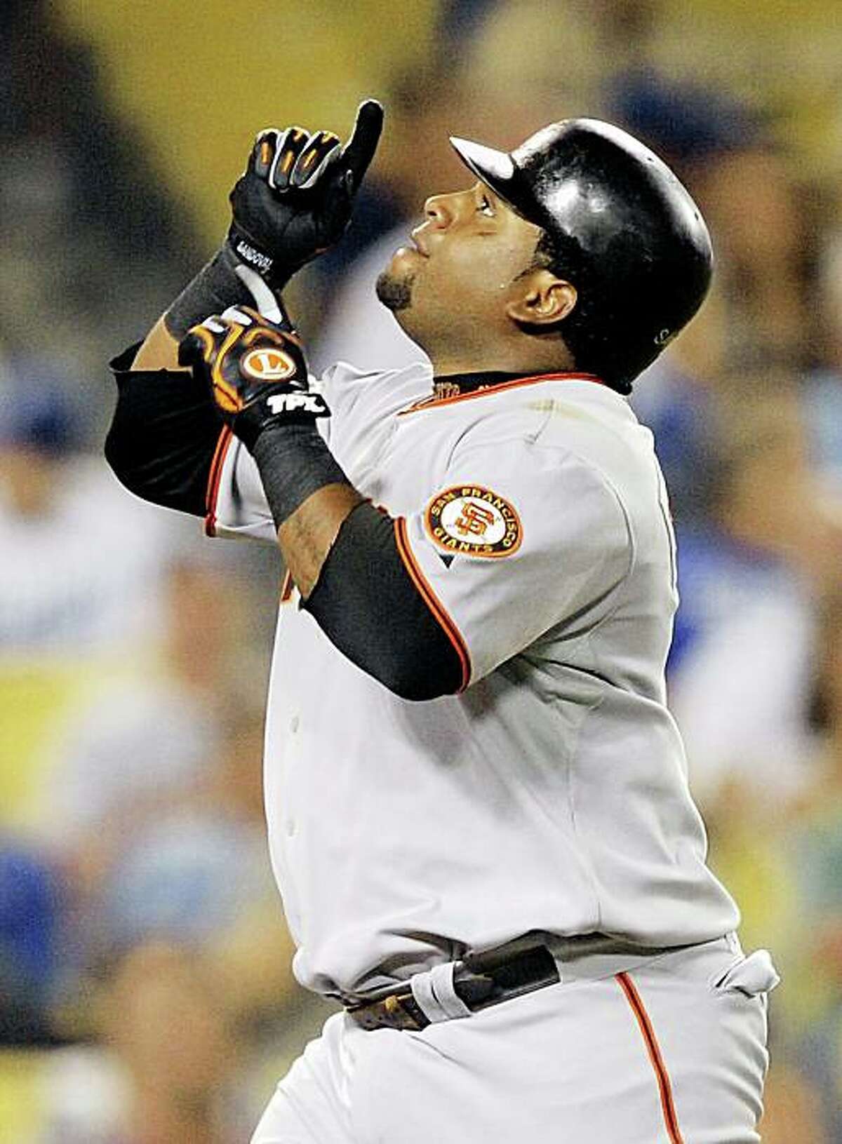 San Francisco Giants' Pablo Sandoval celebrates after hitting a three-run home run during the third inning of their Major League Baseball game against the Los Angeles Dodgers, Friday, Sept. 18, 2009, in Los Angeles. (AP Photo/Mark J. Terrill)