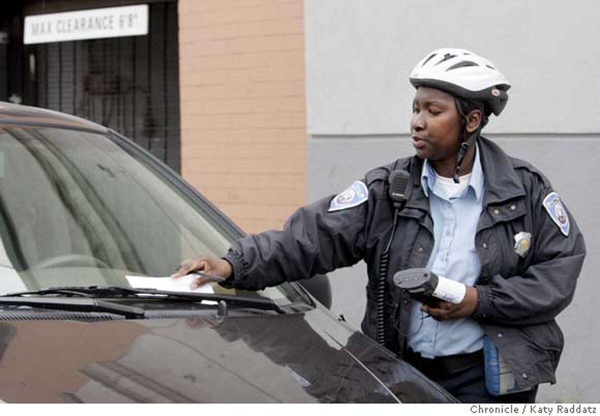 ###Live Caption:PARKING_101_RAD.jpg SHOWN: Parking officer #433 slaps a ticket on a vehicle on Howard St. Parking in San Francisco. These pictures were made on Tuesday, Jan. 30, 2007, in San Francisco, CA. (KATY RADDATZ/SFCHRONICLE)###Caption History:PARKING_101_RAD.jpg SHOWN: Parking officer #433 slaps a ticket on a vehicle on Howard St. Parking in San Francisco. These pictures were made on Tuesday, Jan. 30, 2007, in San Francisco, CA. (KATY RADDATZ/SFCHRONICLE) **###Notes:###Special Instructions:Mandatory credit for the photographer and the San Francisco Chronicle. No sales; mags out.