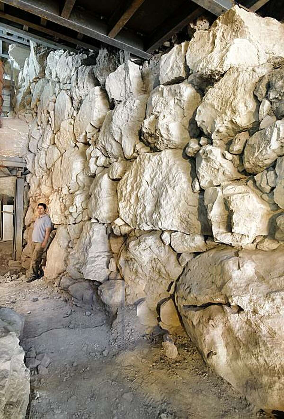 This image made available by Israel's Antiquities Authority Wednesday, Sept. 2, 2009 shows part of a a 3,700-year-old fortification wall discovered in Jerusalem. Archaeologists have discovered a 3,700-year-old wall in the City of David, part of the earliest fortification construction on such a large scale ever found in Jerusalem, the Israel Antiquities Authority said Wednesday. The 26-foot high wall is believed to have been part of a protected passage used by the Biblical Canaanites that led from a fortress on top of a hill to a spring. Ronny Reich, director of the excavation and a professor of archaeology at the University of Haifa, said the discovery marks the first time such "massive construction" before the time of King Herod was found in the oldest parts of the city. (AP Photo/IAA) ** NO SALES **