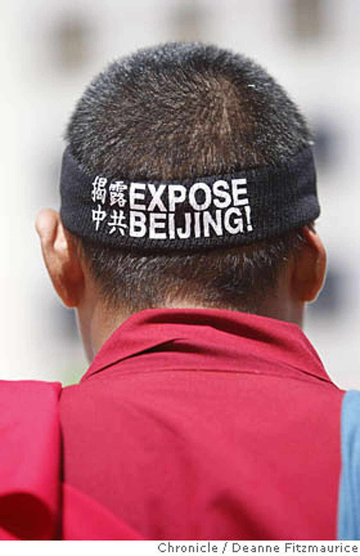 Thupten Tendhar, a buddhist monk from Berkeley, wore a headband as he attended the rally for the start of the Human Rights Torch Relay on April 5, 2008 in San Francisco, Calif. Photo by Deanne Fitzmaurice / San Francisco Chronicle