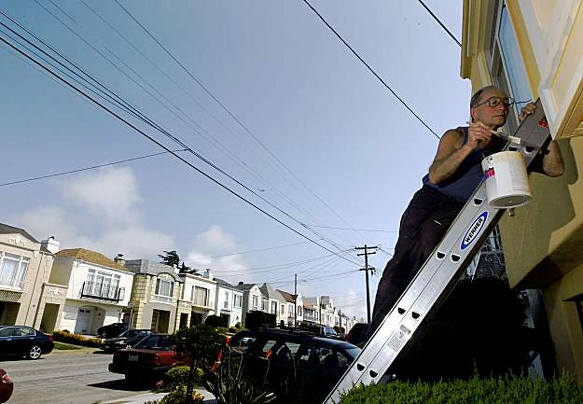 Anatoly Iskoz paints his house on 33rd Street in San Francisco's Sunset District on August 7, 2009. Iskoz isn't concerned about the recent rash of raided pot-growing operations in his neighborhood because he says most of his neighbors are conservative and he doubts they're growing pot.