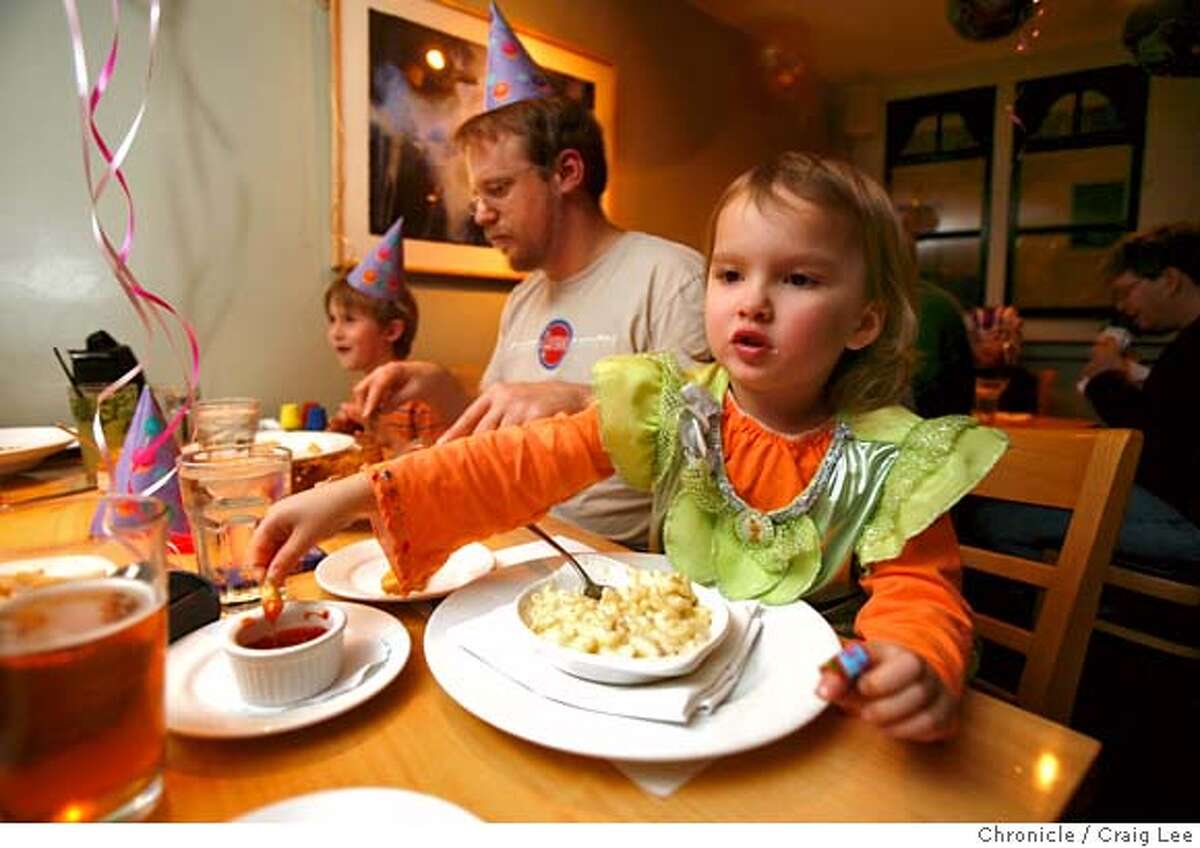 ###Live Caption:Kids night, every Tuesday night, at Chenery Park restaurant, which this night happened to also be Mardi Gras. Photo of Olivia Spreen (right), age 4, dipping her french fries in ketchup. Torbin Bullock, Olivia's Godfather, is sitting next to her. Carter Spreen (left, by the wall), age 7, is Olivia's brother. It was also Olivia's birthday celebration. photo by Craig Lee / The Chronicle###Caption History:Kids night, every Tuesday night, at Chenery Park restaurant, which this night happened to also be Mardi Gras. Photo of Olivia Spreen (right), age 4, dipping her french fries in ketchup. Torbin Bullock, Olivia's Godfather, is sitting next to her. Carter Spreen (left, by the wall), age 7, is Olivia's brother. It was also Olivia's birthday celebration. photo by Craig Lee / The Chronicle###Notes:Joe Kowal, owner, Chenery Park restaurant 415-337-8537 Craig Lee 415-218-8597 clee@sfchronicle.com###Special Instructions:MANDATORY CREDIT FOR PHOTOG AND SF CHRONICLE/NO SALES-MAGS OUT