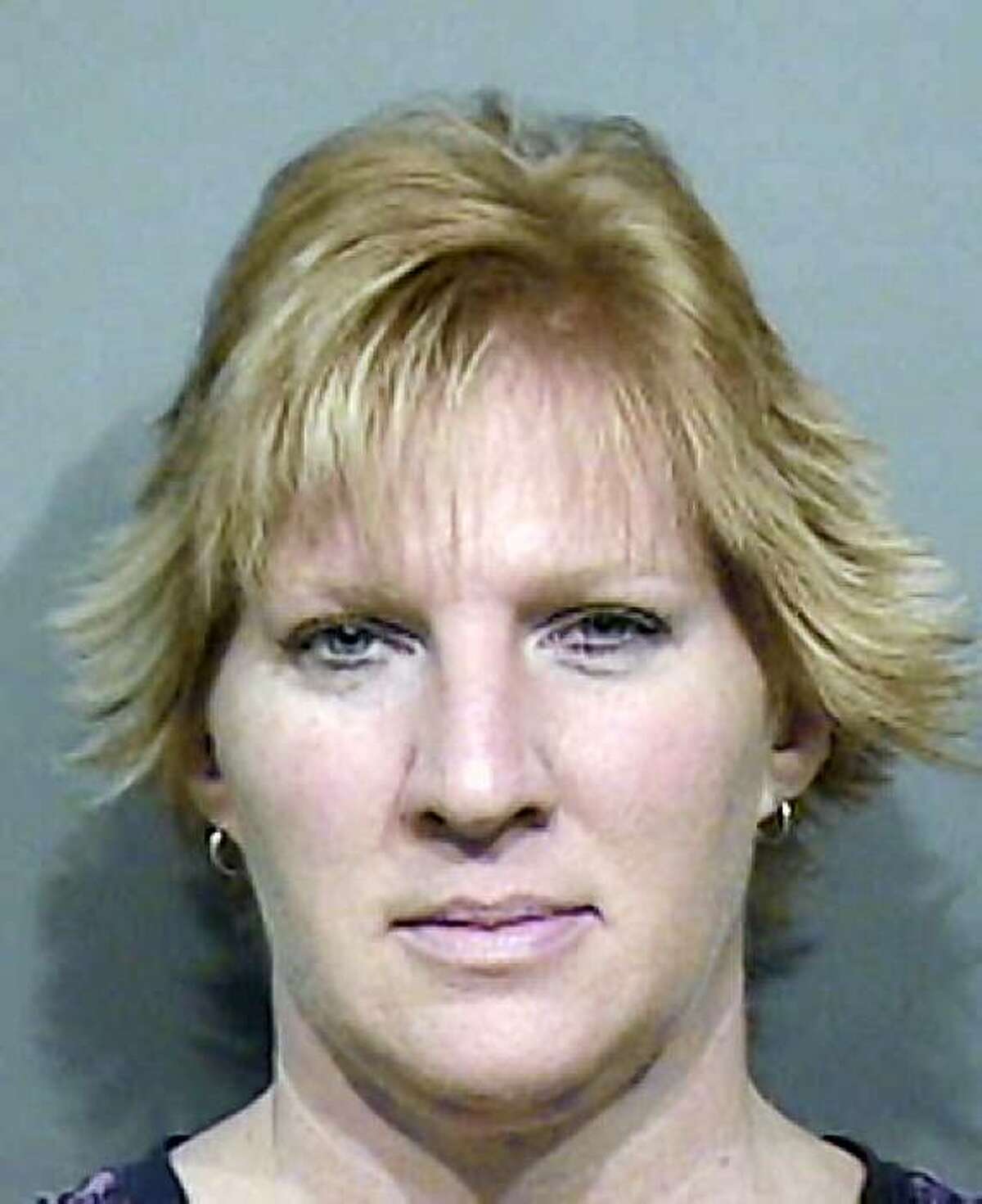 In this photo released by the Calumet County, Wis. Sheriff's Office, Wendy L. Sewell, 43, of Kaukauna, Wis. faces a charge of being a party to false imprisonment. Sewell is one of four women who tied up a man in an eastern Wisconsin motel, blindfolded him and glued a sensitive body part to get their revenge, authorities say. The four, one of them the man's wife, are charged with being party to false imprisonment in what amounts to a lover's triangle gone bad last Thursday, July 30, 2009, according to Calumet County court records. (AP Photo/Calumet County Sheriff's Office)