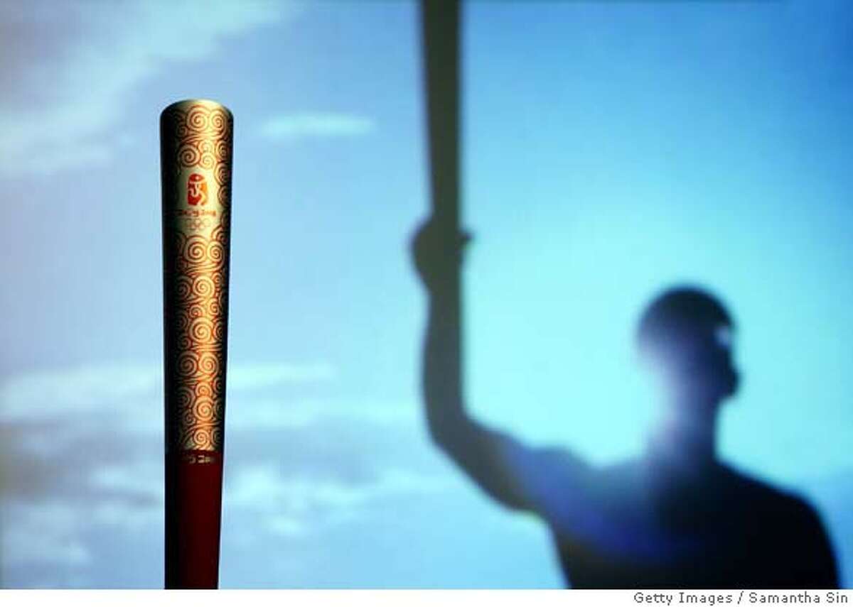 The Beijing 2008 Olympic Torch is unveiled during a press conference in Hong Kong, 13 August 2007. The torch for the Beijing 2008 Olympic Games is designed by Lenovo, and the torch relay will carry the torch from city to city around the world until it arrives at its final destination in Beijing on 08 August 2008 to mark the start of the Beijing 2008 Olympic Games. AFP PHOTO/Samantha SIN (Photo credit should read SAMANTHA SIN/AFP/Getty Images) (Newscom TagID: gettylive942331) [Photo via Newscom] Ran on: 03-12-2008 Ran on: 03-12-2008 Ran on: 03-20-2008