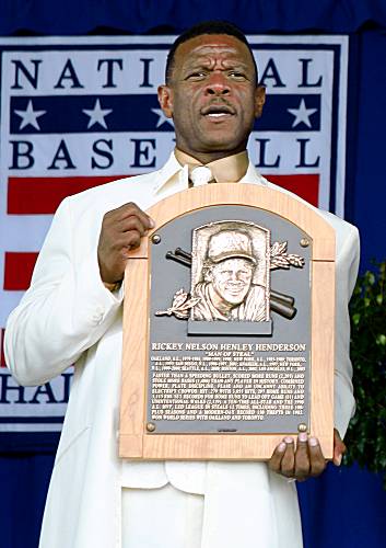 Rickey Henderson's mother, Bobbie Henderson, left, and his wife, Pamela,  laugh as a video introduction for Rickey Henderson is played at the  Baseball Hall of Fame in Cooperstown, N.Y., Sunday, July 26