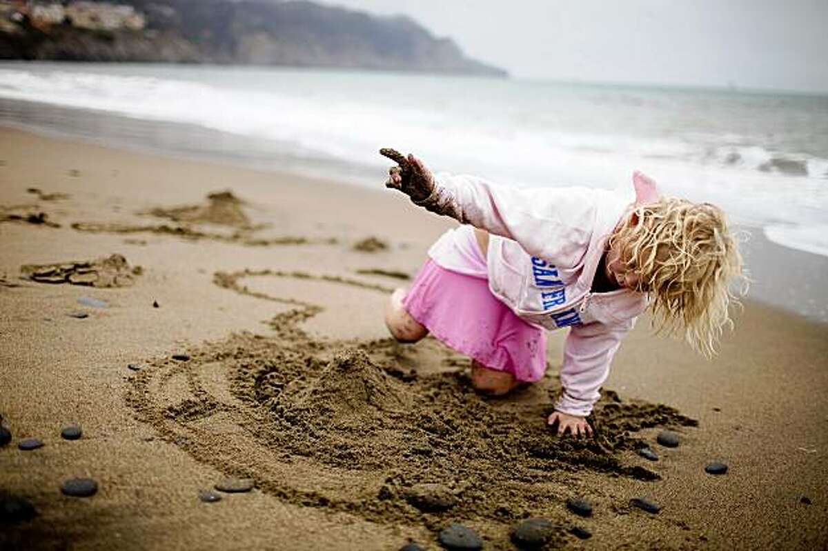 Jennifer Horton, 5, of Oklahoma City, Okla. plays in the sand at Baker Beach, in San Francisco, Calif. on Tuesday, July 28, 2009.