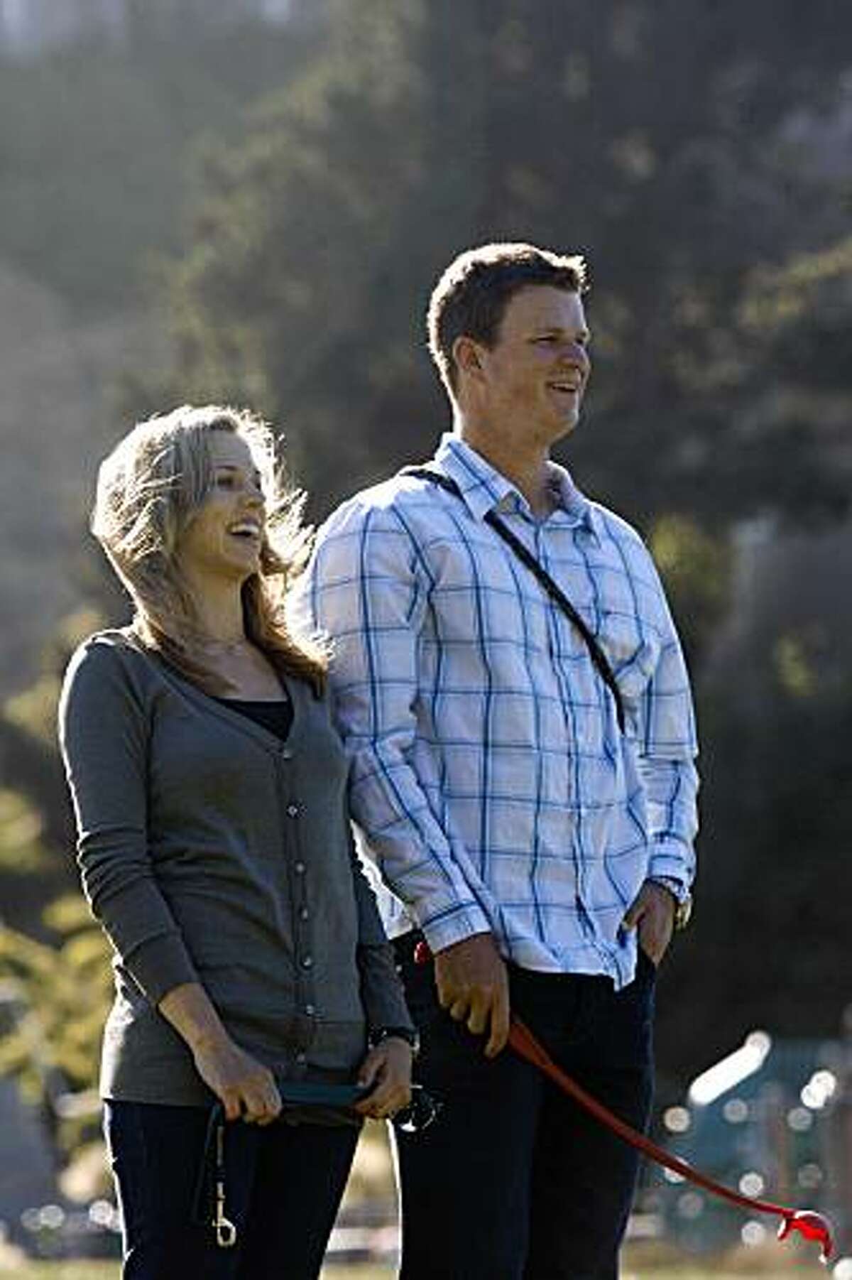 Giants pitccher Matt Cain (right) and fiance Chelsea Williams (left) share a laugh as they watch their dogs catch a ball on Sunday June 21, 2009 in San Francisco, Calif.