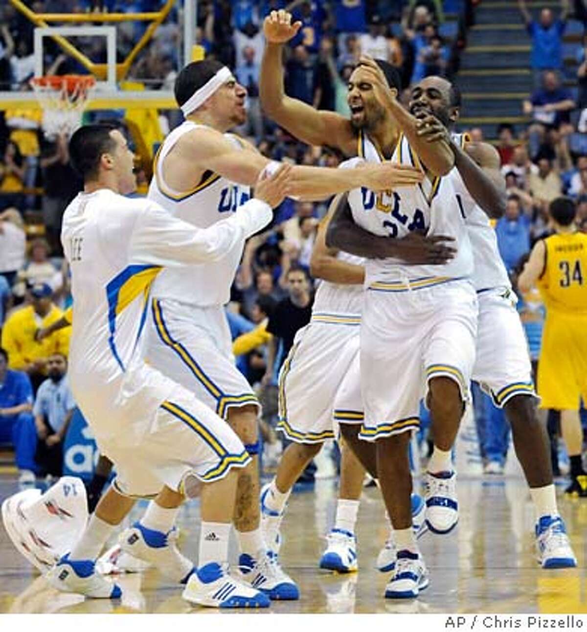 ###Live Caption:UCLA's Josh Shipp, second from right, is mobbed by teammates, from left, Matt Lee, Lorenzo Mata-Real and Luc Richard Mbah a Moute, after his last-second shot defeated California 81-80 in a basketball game in Los Angeles, Saturday, March 8, 2008. (AP Photo/Chris Pizzello)###Caption History:UCLA's Josh Shipp, second from right, is mobbed by teammates, from left, Matt Lee, Lorenzo Mata-Real and Luc Richard Mbah a Moute, after his last-second shot defeated California 81-80 in a basketball game in Los Angeles, Saturday, March 8, 2008. (AP Photo/Chris Pizzello)###Notes:Josh Shipp, Luc Richard Mbah a Moute, Matt Lee, Lorenza Mata-Real###Special Instructions:EFE OUT