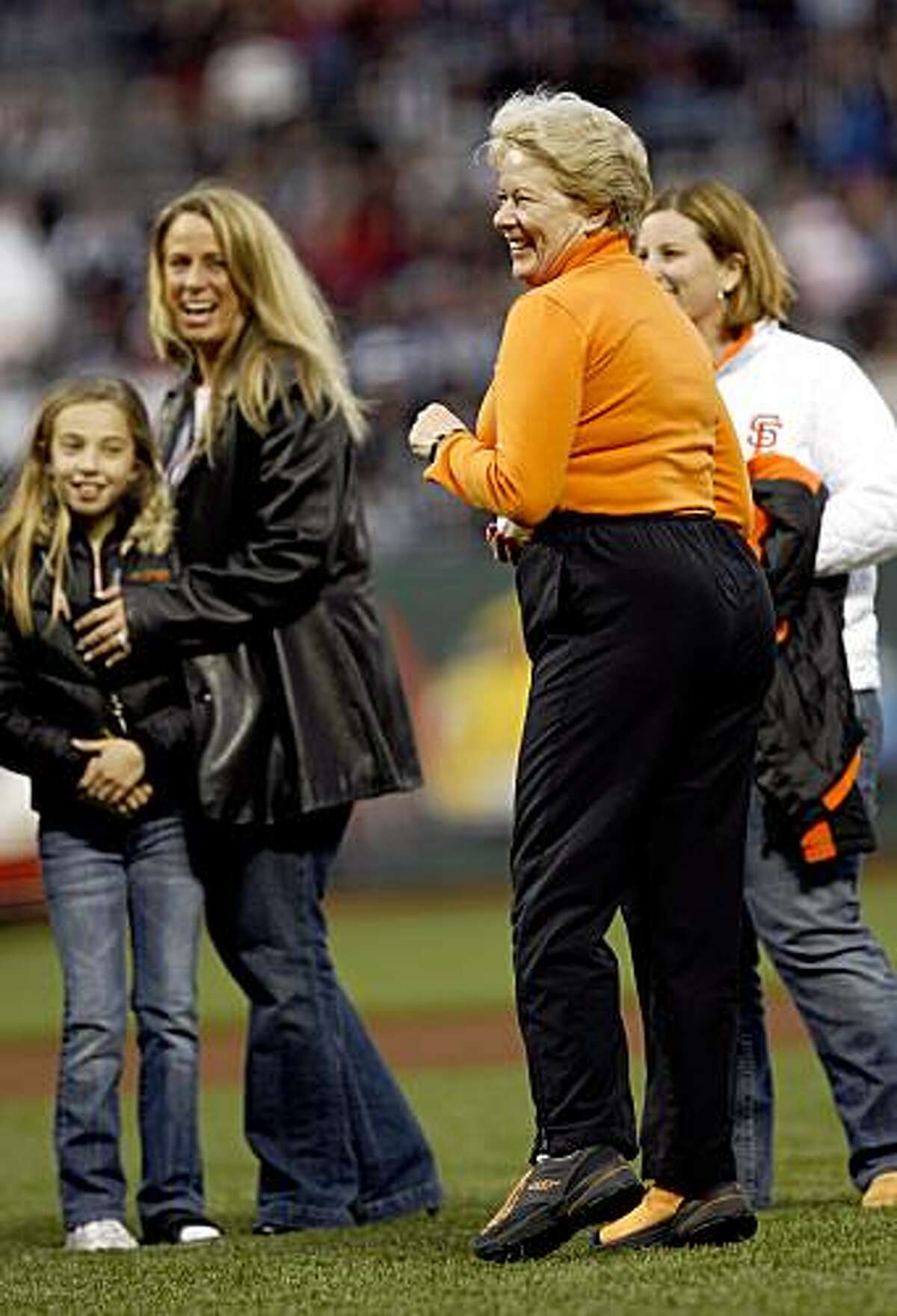 In this April 4, 2007, photo, San Francisco Giants' owner Sue Burns prepares to throw the first pitch in honor of her late husband, Harmon Burns, who had died the previous year, at a baseball game in San Francisco, Calif. Sue Burns, a part owner of the Giants, died late Saturday, July 18, 2009. Burns, 58, died of complications from cancer, team spokesman Jim Moorehead said Sunday.