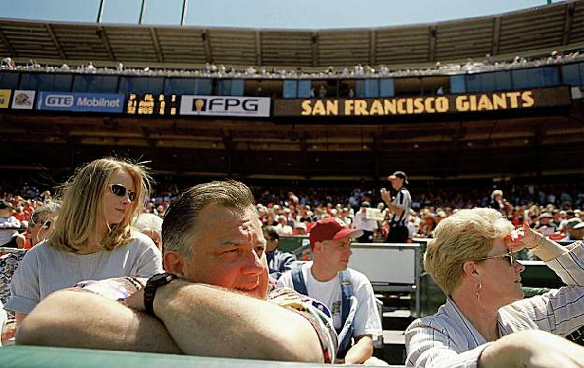 In an August 1998 photo, San Francisco Giants owners Harmon Burns, front left, and his wife, Sue Burns, right, attend a Giants baseball game with daughter Trina Dean, left, in San Francisco. Sue Burns, who was close friends Bonds, died late Saturday, July 18, 2009. Burns, 58, died of complications from cancer, team spokesman Jim Moorehead said Sunday. Harmon Burns died in 2006. (AP Photo/San Francisco Chronicle, Tim Kao) ** MANDATORY CREDIT MAGS OUT NO SALES **