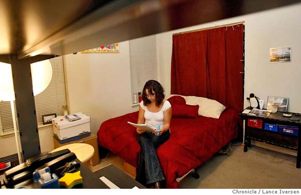 ###Live Caption:Alexandra Loucks, a 25-year-old doctoral student at University of California studies on her bed, in her studio apartment in the Mission. She will soon be moving into a one-bedroom condo in Mission Bay, more than doubling her living space from 400 Sq feet to over a 1,000. This area of San Francisco was once considered the wrong side of the Market Street; do to its industrial, hard-core feel and crime. Loucks and some of her new neighbors will soon be residents of San FranciscoÕs newest neighborhoods. As buildings open, planning progresses and buyers put down deposits across SoMa, long the province of industrial and office buildings, the outlines of the cityÕs emerging residential districts are coming into focus: Mid-Market, Transbay, Rincon Hill and furthest along, Mission Bay. Photo taken in San Francisco on Thursday March 6, 2008. Photo by Lance Iversen / San Francisco Chronicle###Caption History:Alexandra Loucks, a 25-year-old doctoral student at University of California studies on her bed, in her studio apartment in the Mission. She will soon be moving into a one-bedroom condo in Mission Bay, more than doubling her living space from 400 Sq feet to over a 1,000. This area of San Francisco was once considered the wrong side of the Market Street; do to its industrial, hard-core feel and crime. Loucks and some of her new neighbors will soon be residents of San Francisco�s newest neighborhoods. As buildings open, planning progresses and buyers put down deposits across SoMa, long the province of industrial and office buildings, the outlines of the city�s emerging residential districts are coming into focus: Mid-Market, Transbay, Rincon Hill and furthest along, Mission Bay. Photo taken in San Francisco on Thursday March 6, 2008. Photo by Lance Iversen / San Francisco Chronicle###Notes:Lance Iversen...