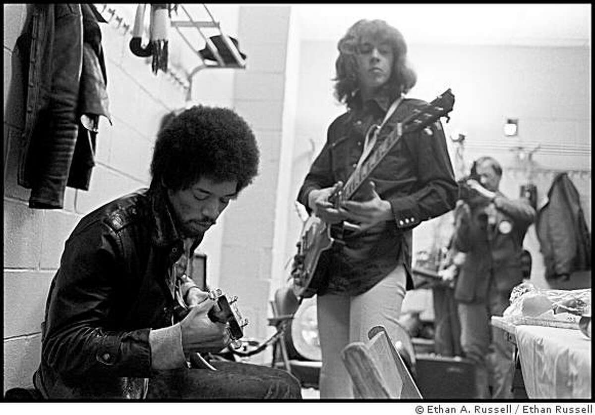 Jimi Hendrix and Mick Taylor of the Rolling Stones back stage at Madison Square Garden, New York, NY., 1969.Photo credit: Ethan Russell