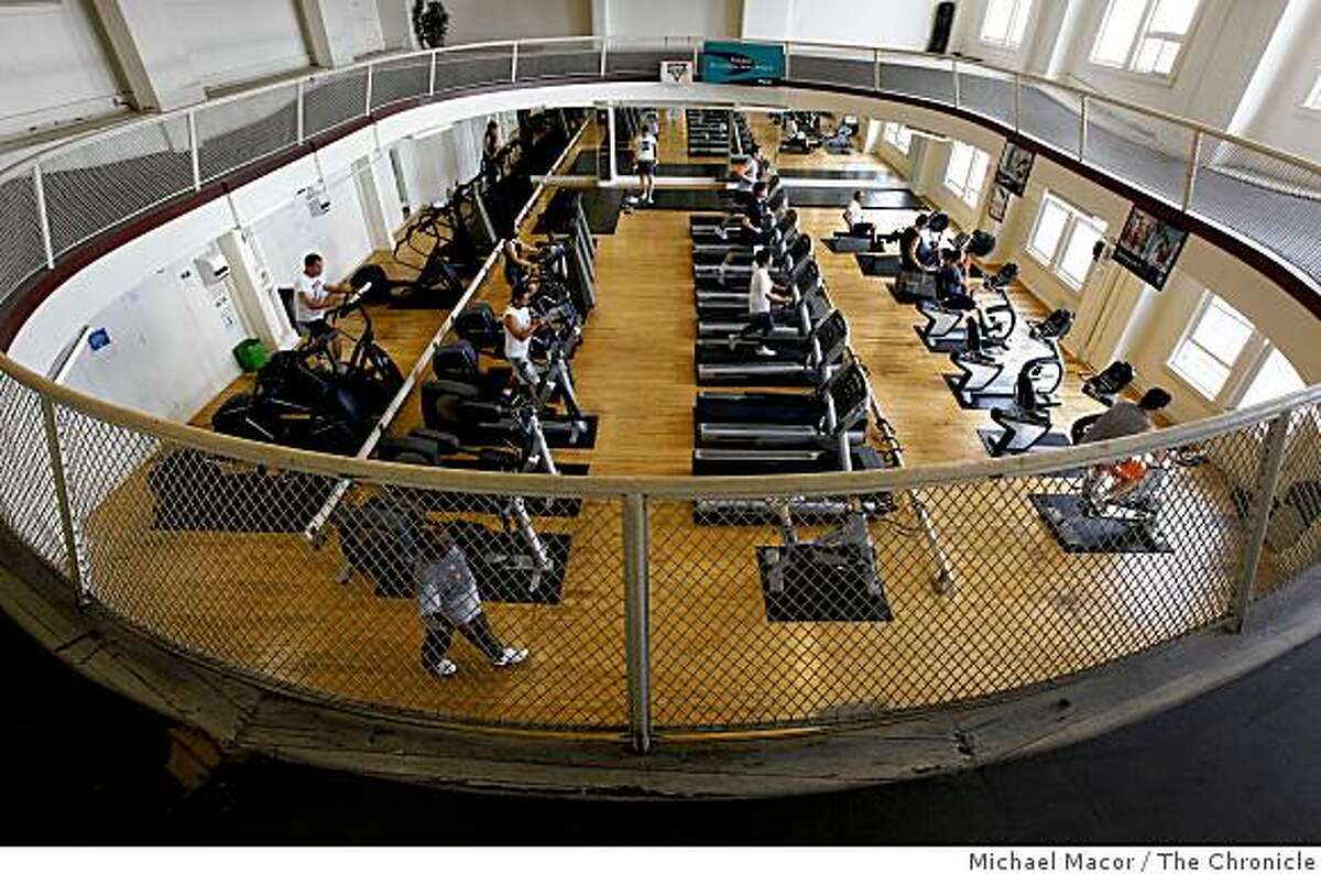 The fitness room with a running track around the upper level at the Shih Yu-Lang Central YMCA in the Tenderloin of San Francsico, Calif., on Wednesday May 6, 2009. The gym, pool and fitness room will close on June 30 to make way for affordable housing for the homeless.