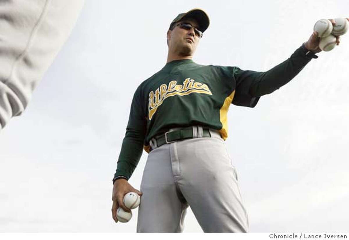 Oakland Athletics new bench coach Don Wakamatsu talks with his players during first day of spring training at Papago Park in Phoenix, Thursday morning. By Lance Iversen/The San Francisco Chronicle MANDATORY CREDIT PHOTOG AND SAN FRANCISCO CHRONICLE/NO SALES MAGS OUT