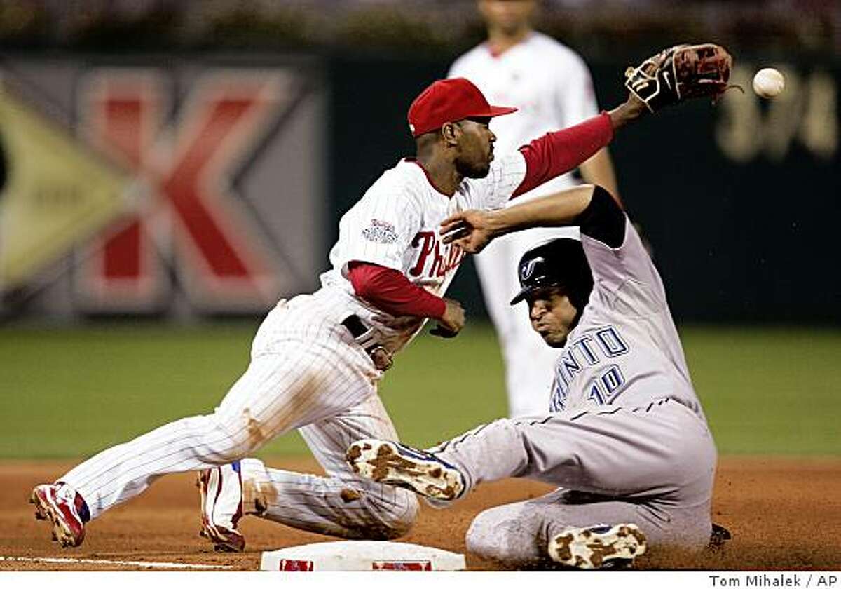 Philadelphia Phillies' Scott Rolen scores on a solo second-inning