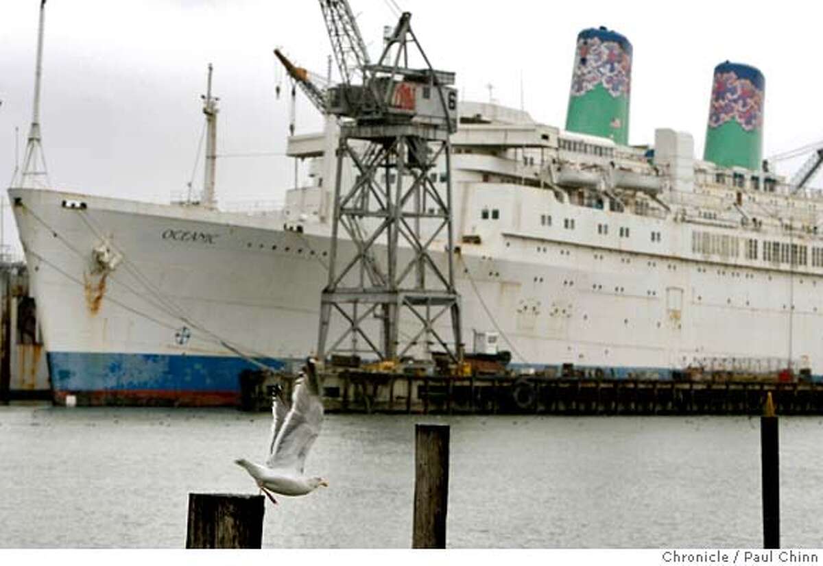 A gull takes flight in front of the ocean liner Oceanic docked at the Pier 70 shipyard in San Francisco, Calif. on Tuesday, Jan. 29, 2008. The ship, formally known as the Independence, is one of the last American-built cruise ships still plying the waters MANDATORY CREDIT FOR PHOTOGRAPHER AND S.F. CHRONICLE/NO SALES - MAGS OUT