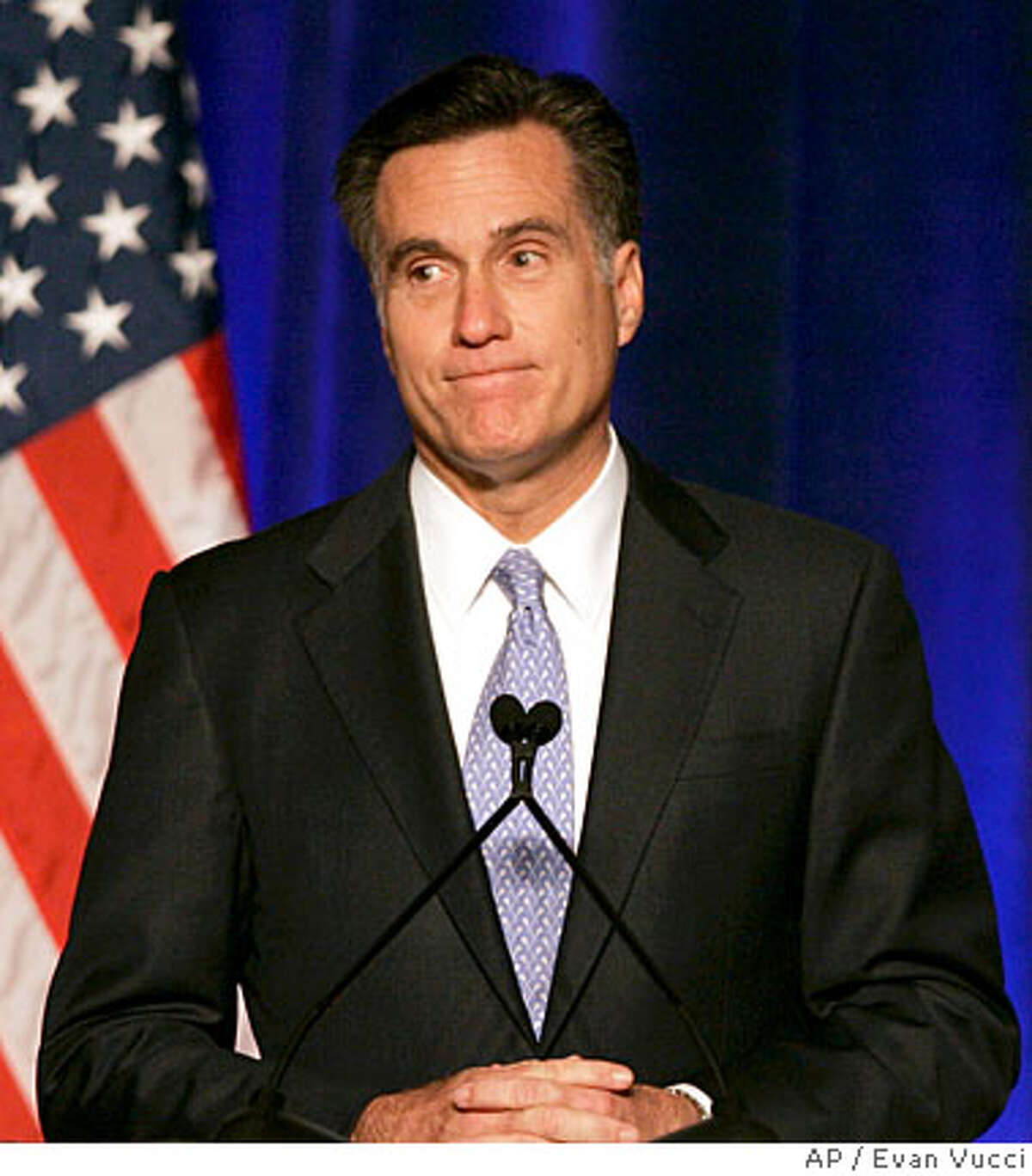 Former Massachusetts Gov. Mitt Romney pauses during a speech before the Conservative Political Action Conference, Thursday, Feb. 7, 2008, in Washington, where he announced he was suspending his faltering presidential campaign. (AP Photo/Evan Vucci)