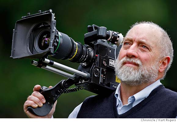 An NFL Films camera operator works during the first half of a