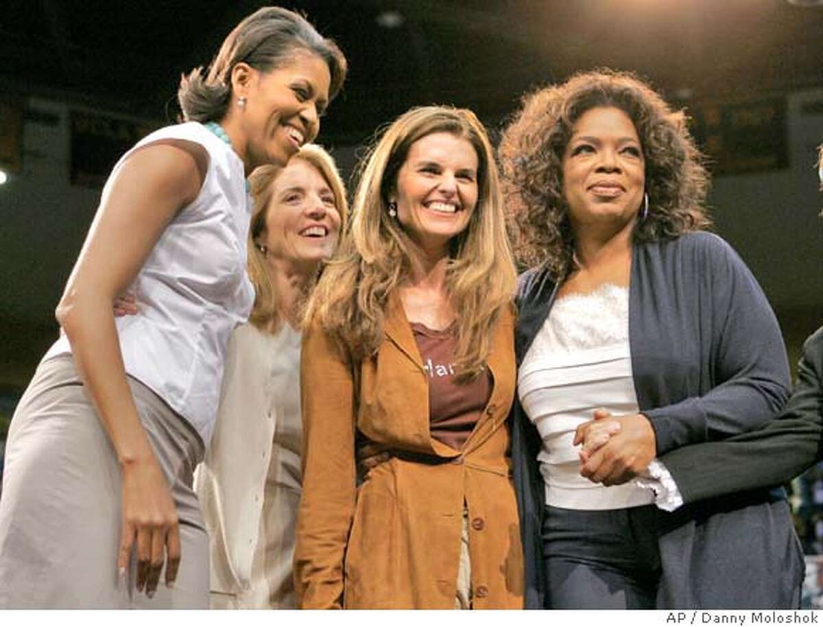 (L-R) Michelle Obama, Caroline Kennedy, Maria Shriver and Oprah Winfrey stand together after they each spoke during a rally for Democratic presidential candidate US Senator Barack Obama (D-IL) at UCLA's Pauley Pavilion in Los Angeles, California, February 3, 2008. REUTERS/Danny Moloshok (UNITED STATES) US PRESIDENTIAL ELECTION CAMPAIGN 2008 (USA)