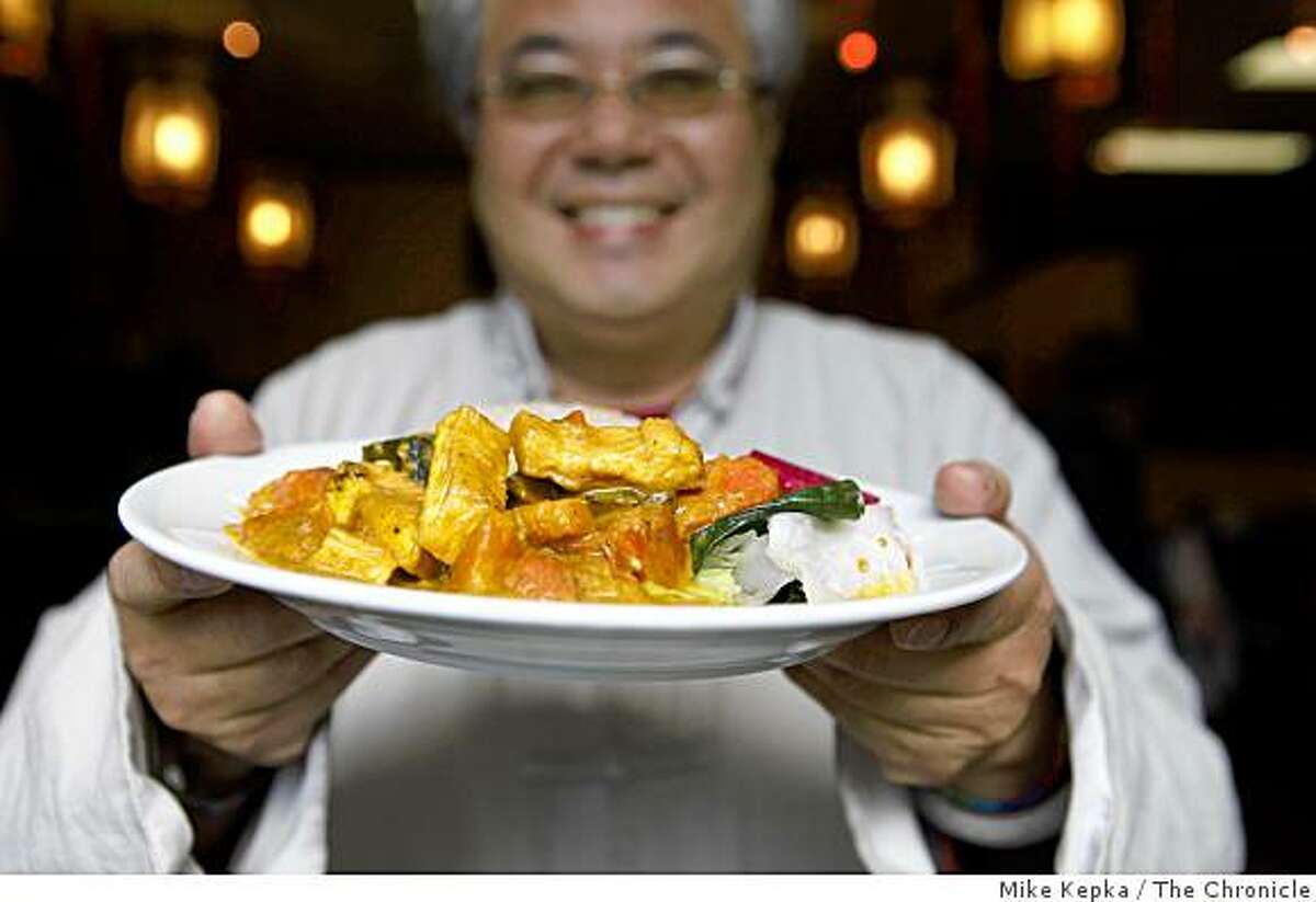 Imperial Tea Court owner Roy Fong, who is leading the charge to use sustainable ingredients in traditional Chinese dim sum, holding Veggie Curry Tofu stands for a picture in his restaurant on Tuesday April 28, 2009 in Berkeley, Calif.