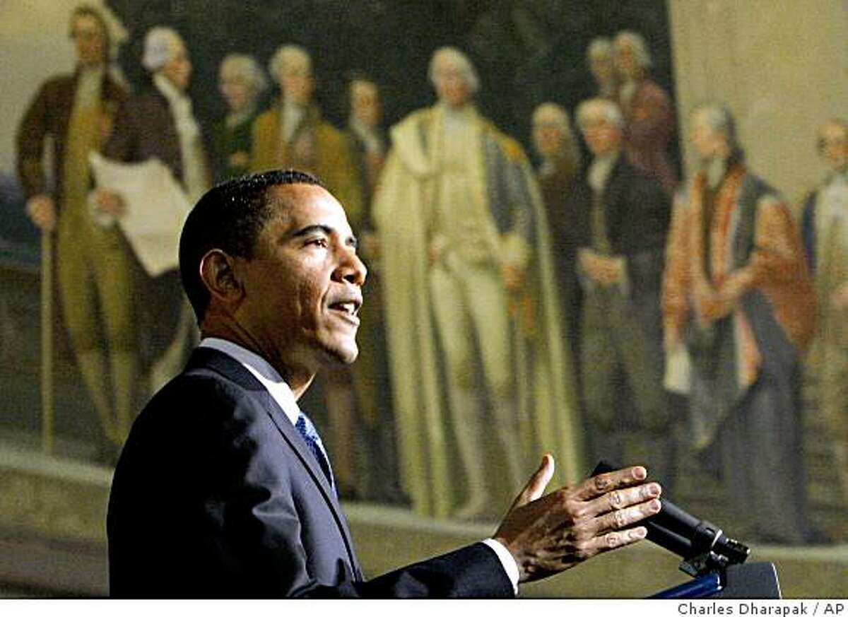President Barack Obama delivers an address on national security, terrorism, and the closing of Guantanamo Bay prison, Thursday, May 21, 2009 at the National Archives in Washington. Above is a mural painted by Barry Faulkner in 1936 of the Constitution Convention depicting James Madison delivering the final draft of the Constitution to George Washington. (AP Photo/Charles Dharapak)