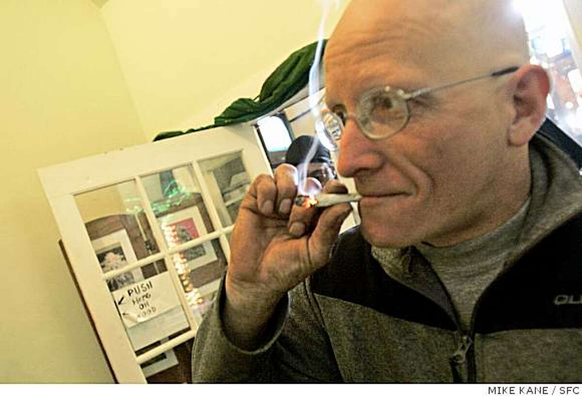 Brent Saupe, a medical marijuana patient now living in San Mateo, medicates (smokes marijuana) at Hope Net, a marijuana dispensary in San Francisco in 2007. Saupe is a veteran with compacted vertebrate and joint problems.