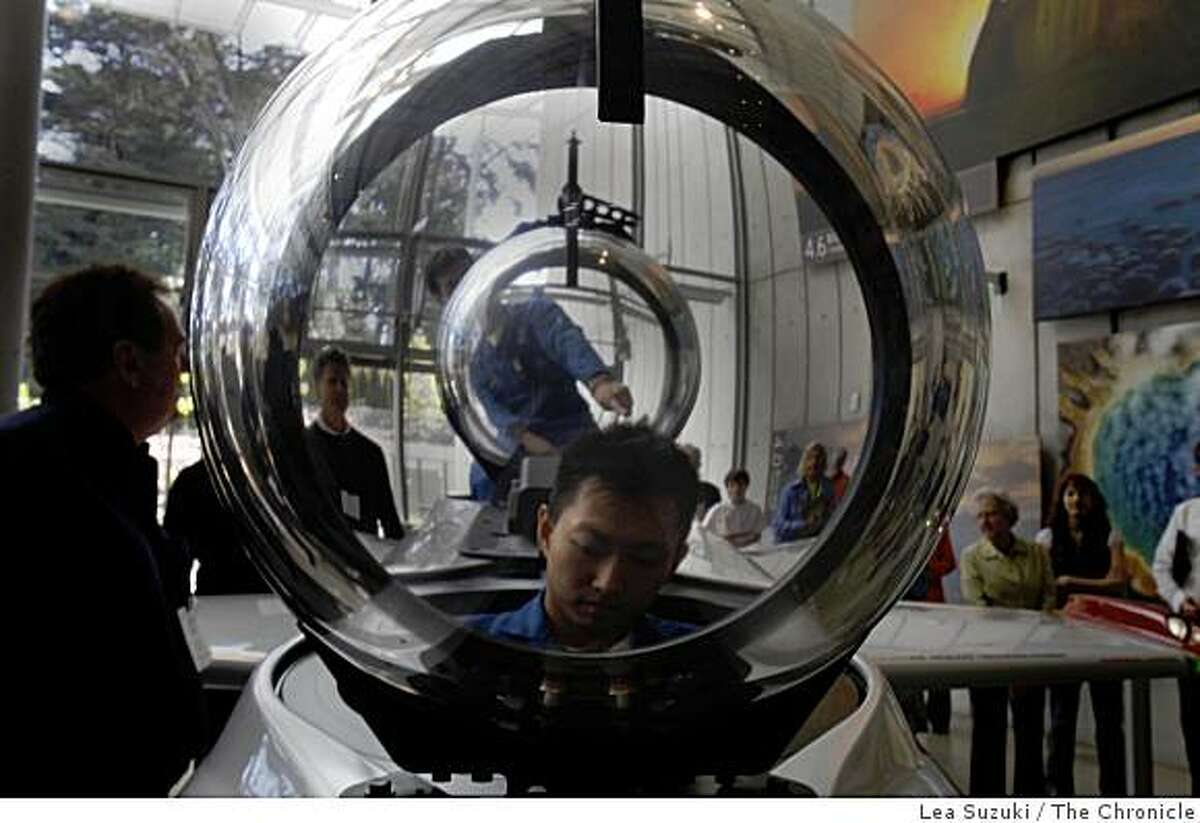 Charles Chiau, chief electronics engineer of Hawkes Ocean Technologies, sits in the cockpit of Deep Flight Super Falcon after it's unveiling at the California Academy of Sciences on Wednesday May 13, 2009 in San Francisco, Calif.