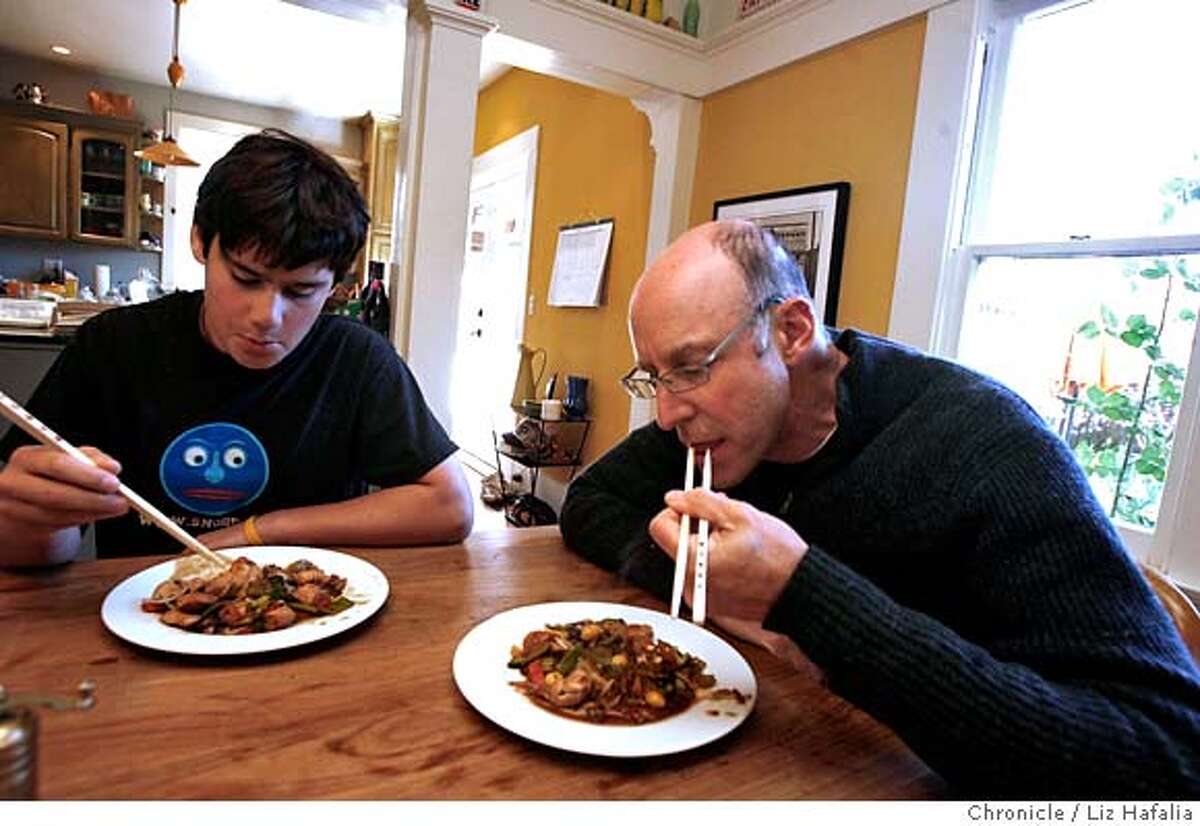 POLLAN_096_LH.JPG Michael Pollan and his son Isaac Pollan, 15 years old, sit down to eat the stir fry they made for lunch. Michael Pollan has become the leader of the Bay Area movement for better food, the farm bill, local food, farmers' markets, etc., and is out with a new book. Liz Hafalia/The Chronicle/BERKELEY/1/1/08 **Michael Pollan, Isaac Pollan cq �2007, San Francisco Chronicle/ Liz Hafalia MANDATORY CREDIT FOR PHOTOG AND SAN FRANCISCO CHRONICLE. NO SALES- MAGS OUT.
