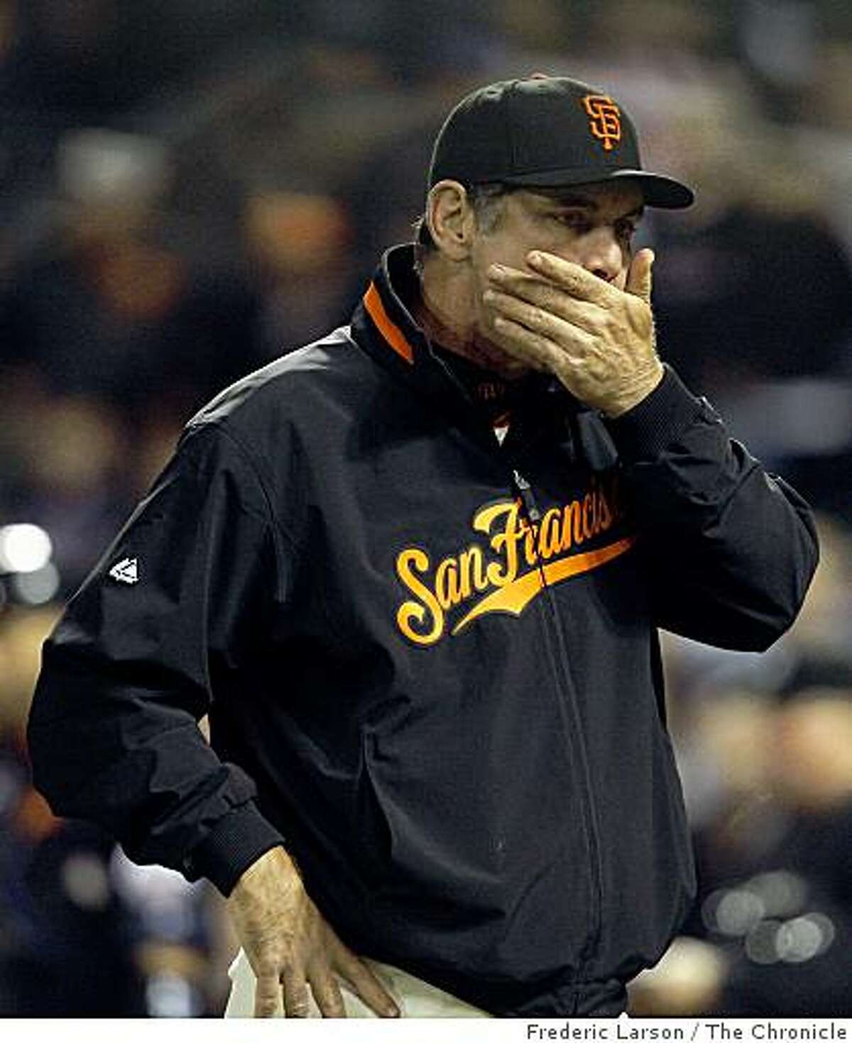 Giants manager Bruce Bochy seem a little concern after his player Edger Renteria left the game with a injury in the 8th inning as the Giants when on to lose to the Mets in the first game of the series at AT&T Park in San Francisco Calif on May 14, 2009.