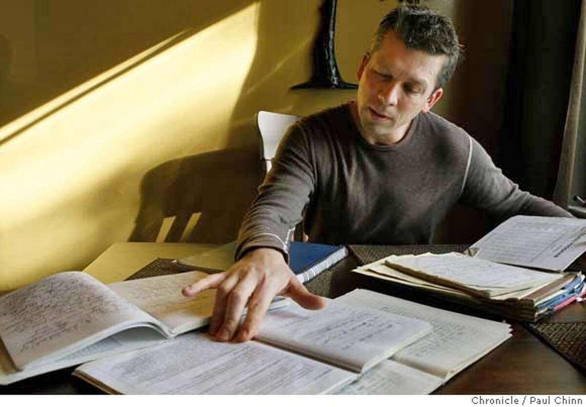 Gulf War veteran Sean McLean Brown browses through journals he wrote while serving in Iraq in the 90's at his home in Palo Alto, Calif. on Saturday, Dec. 22, 2007. Many of Brown's writings, as a member of a veteran's writing group, were published in the book "Veterans of War, Veterans of Peace", which was edited by author Maxine Hong Kingston. PAUL CHINN/The Chronicle **Sean McLean Brown MANDATORY CREDIT FOR PHOTOGRAPHER AND S.F. CHRONICLE/NO SALES - MAGS OUT
