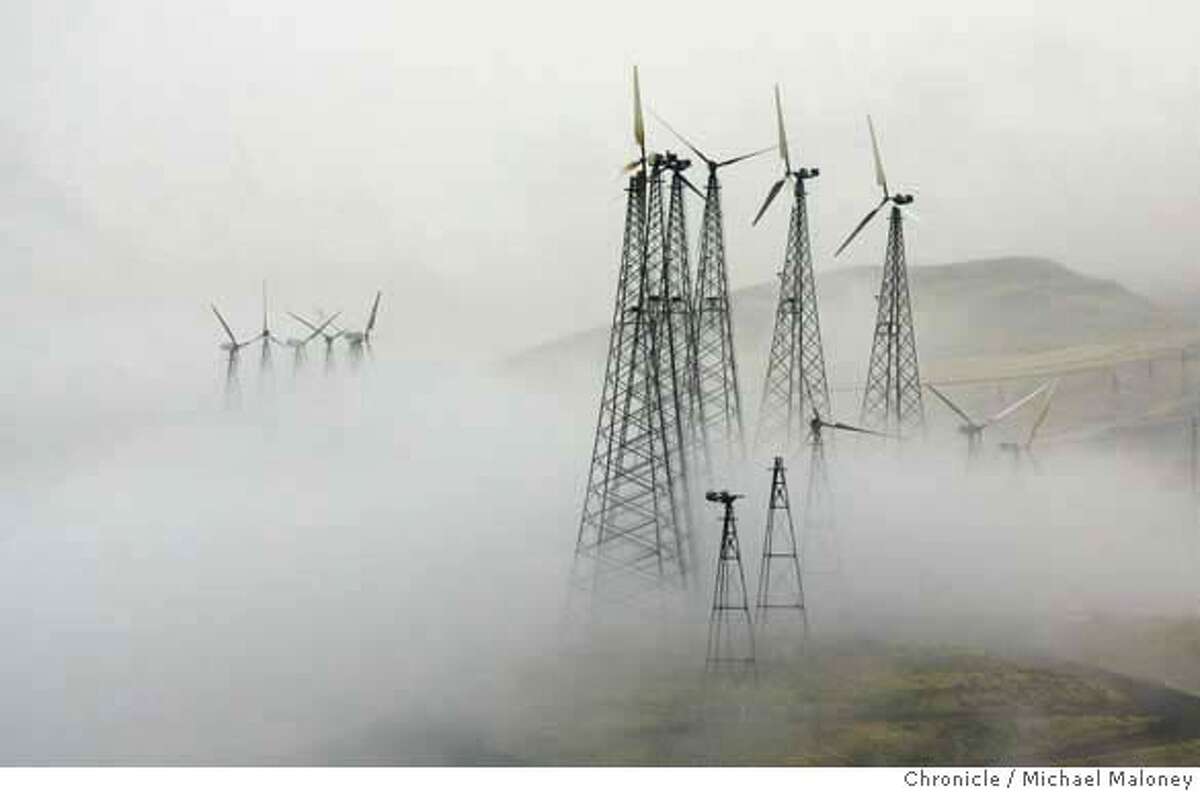 Wind turbines in the fog covered hills of the Altamont Pass. This time of the year they are shut down to reduce bird kills. Recent studies of wind farms in the Altamont Pass near Livermore estimated that electricity-producing windmills kill thousands of birds a year, including many birds of prey such as the golden eagle, red-tailed hawk, American kestral and burrowing owls.The result of these studies has been a prolonged civil war in the environmental camp, pitting defenders of wildlife against promoters of climate-friendly renewable energy, with Alameda County supervisors left to decide what to do. Photo by Michael Maloney / San Francisco Chronicle MANDATORY CREDIT FOR PHOTOG AND SF CHRONICLE/NO SALES-MAGS OUT