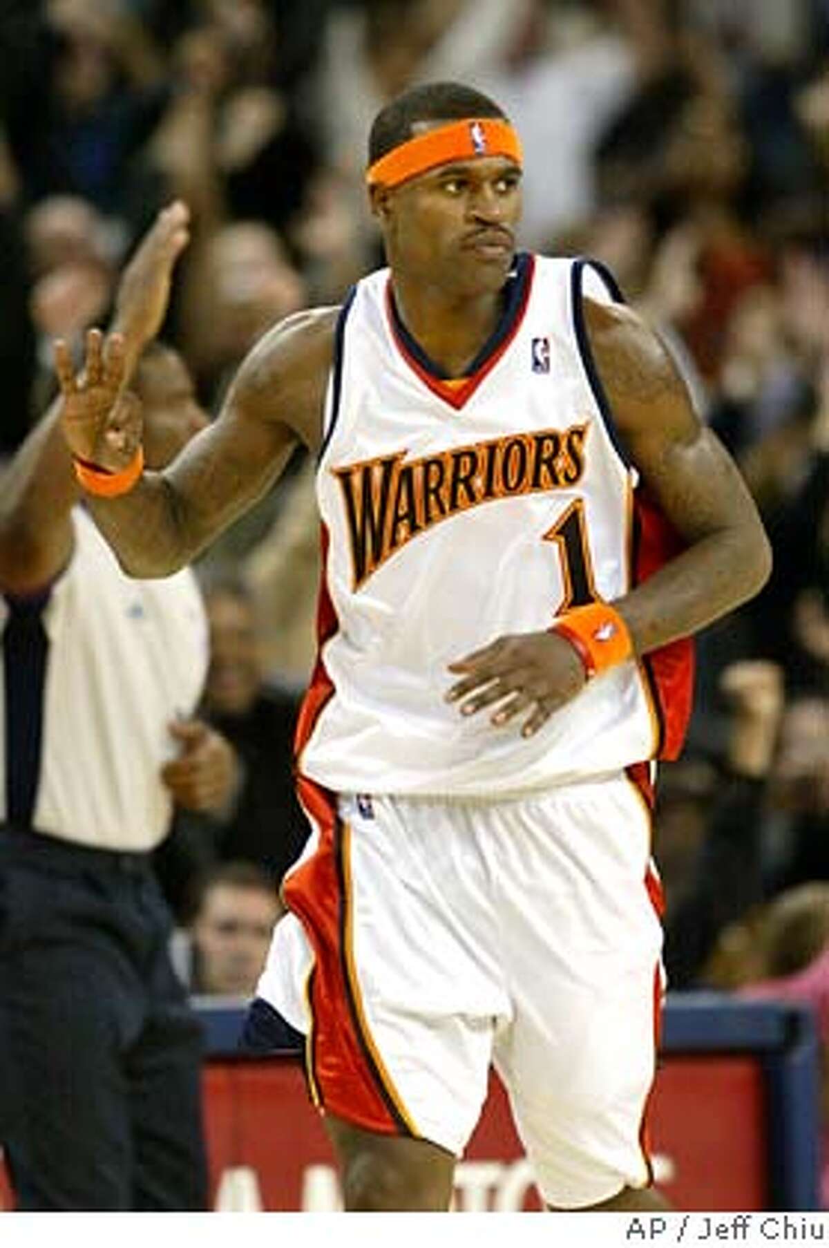 ** ADVANCE FOR WEEKEND EDITIONS, DEC. 8-9 ** Golden State Warriors guard Stephen Jackson (1) celebrates after making a three-pointer against the Orlando Magic in the fourth quarter of an NBA basketball game on Monday, Dec. 3, 2007, in Oakland, Calif. The Magic won 123-117 in overtime. Jackson's arrival in Golden State last season helped turned the Warriors from a sorry franchise that had missed the playoffs for 12 straight seasons into a team that went on a magical playoff run. His return from a seven-game suspension to open this season has had similar results, as the Warriors have overcome an 0-6 start without Captain Jack to get right back to the groove they were in to end last season. (AP Photo/Jeff Chiu) EFE OUT