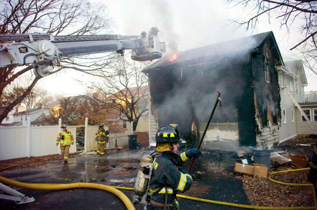 Firefighters battle a fire on Gilford St. in Stamford, Nov. 3, 2009.