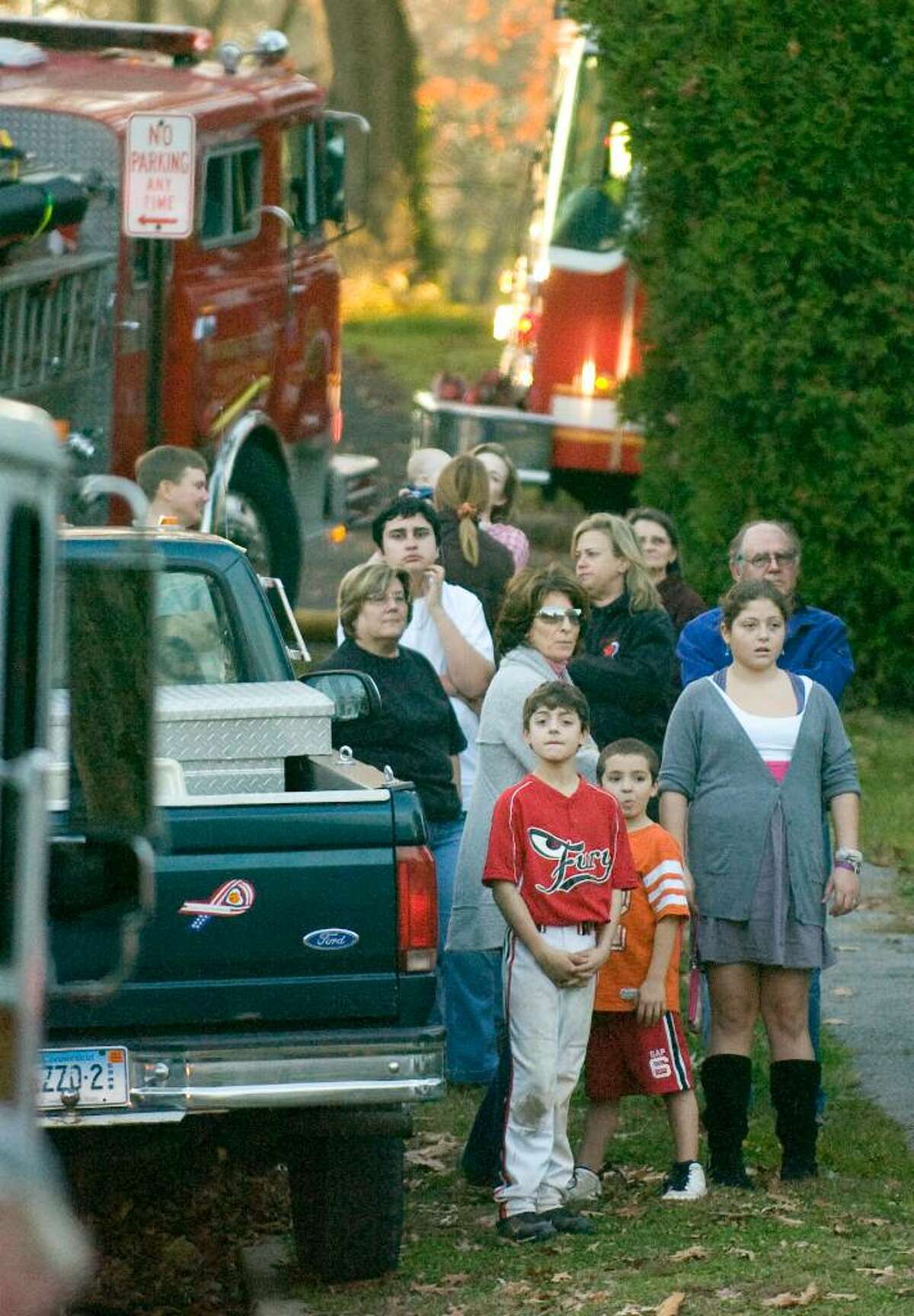 while firefighters battle a fire on Gilford St. in Stamford, Nov. 3, 2009.
