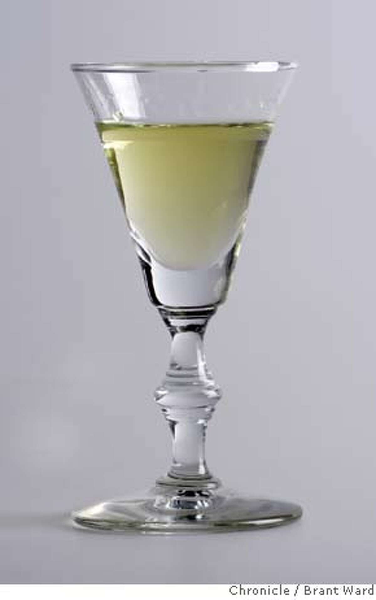 absinthe_836.JPG A glass of absinthe photographed at the Chronicle studio. One glass also contains sugar which clouds the liquor. {By Brant Ward/San Francisco Chronicle}12/4/07