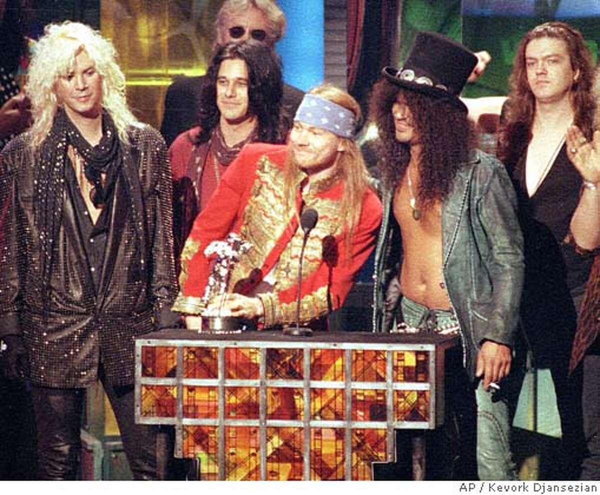** FILE ** Guns N' Roses, from left, Michael "Duff" McKagan, Dizzy Reed, Axl Rose, Saul "Slash" Hudson and Matt Sorum, receives the Michael Jackson Video Vanguard Award for "November Rain" at the MTV Video Music Awards ceremony in Los Angeles, Ca., on Sept. 9, 1992. "Slash" and "Duff" have sued frontman Axl Rose for allegedly naming himself sole administrator of the group's copyrights. The suit was filed Aug. 17, 2005 in Los Angeles. (AP Photo/Kevork Djansezian, File)