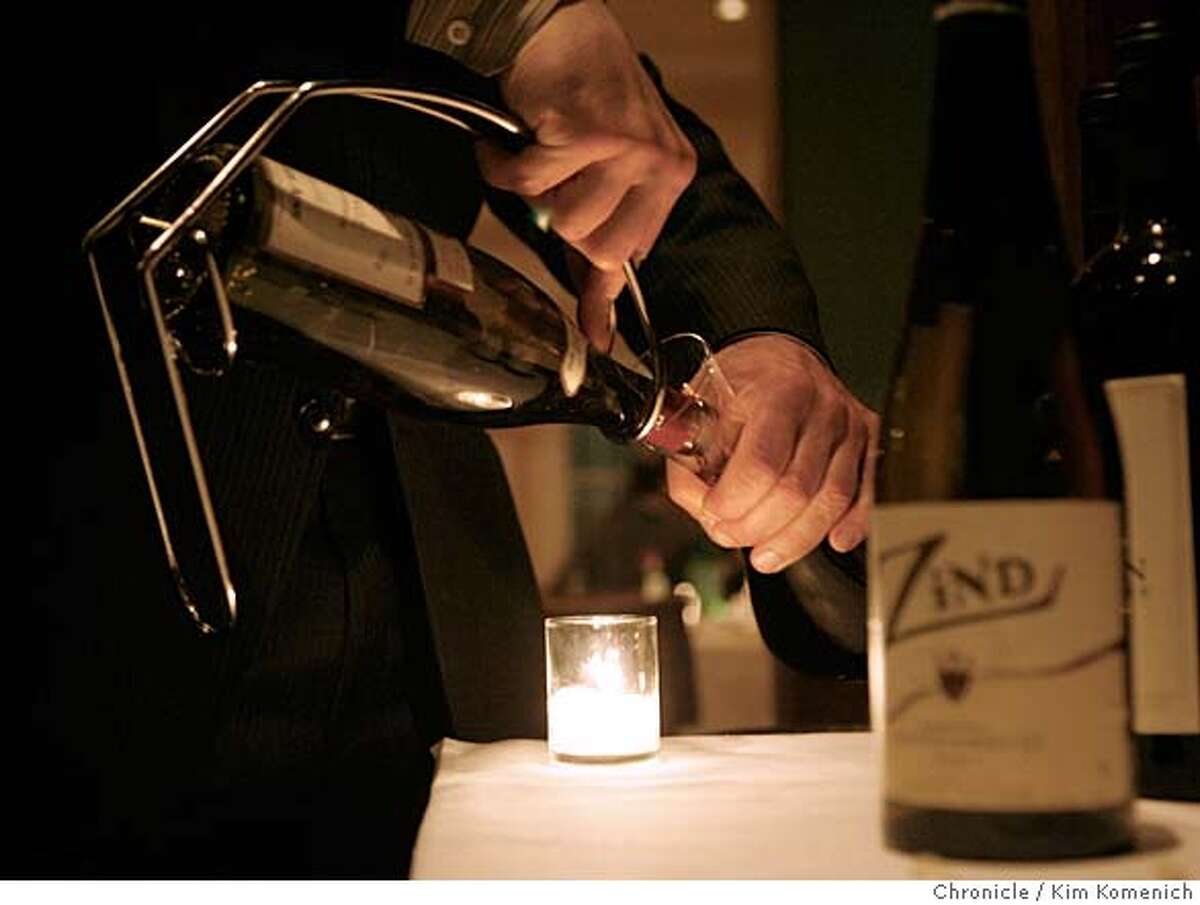 ESSENTIALS09_020_KK.JPG Rubicon sommelier Cezar Kusik (CQ) is responsible for guiding customers' wine choices in all its dining rooms. Here he decants some wine. Photo by Kim Komenich/The Chronicle **Cezar Kusik ** MANDATORY CREDIT FOR PHOTOG AND SAN FRANCISCO CHRONICLE. NO SALES- MAGS OUT.