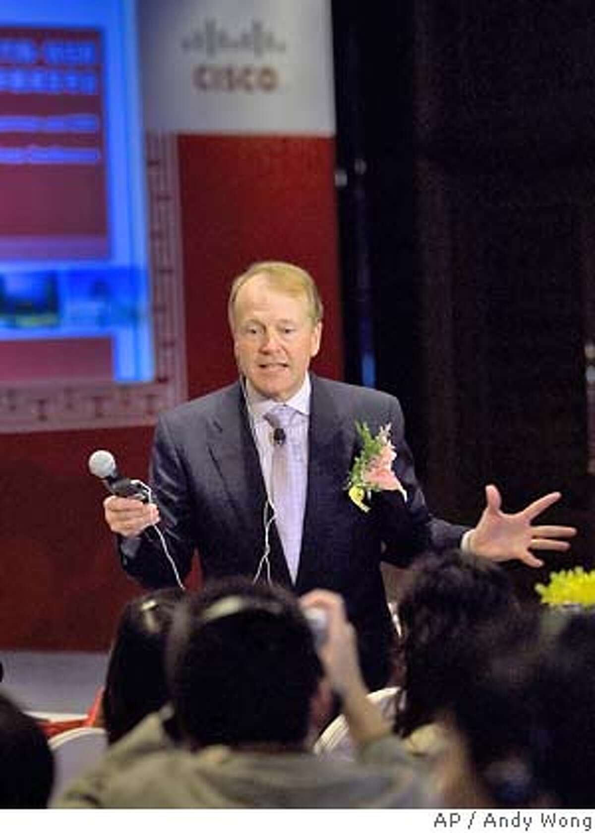 Cisco Chief Executive John Chambers speaks to the journalists during a news conference at a hotel in Beijing, China, Thursday, Nov. 1, 2007. Network gear maker Cisco Systems Inc. on Thursday announced a multi-year, US$16 billion (euro11.1 billion) series of initiatives to expand in China with investments in manufacturing, venture capital and education efforts. (AP Photo/Andy Wong) Ran on: 11-02-2007 Cisco CEO John Chambers toasts to the growing relationship with Jack Ma, chairman and CEO of Alibaba.