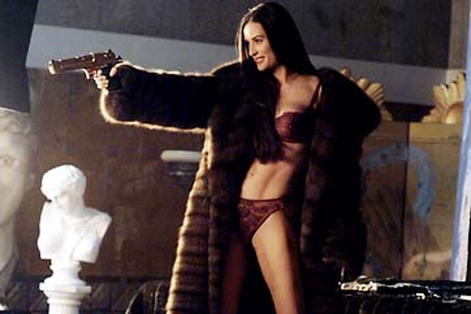 Demi Moore's fishy love encounter; Arnie on a short leash; Tommy Lee, naked  and huge