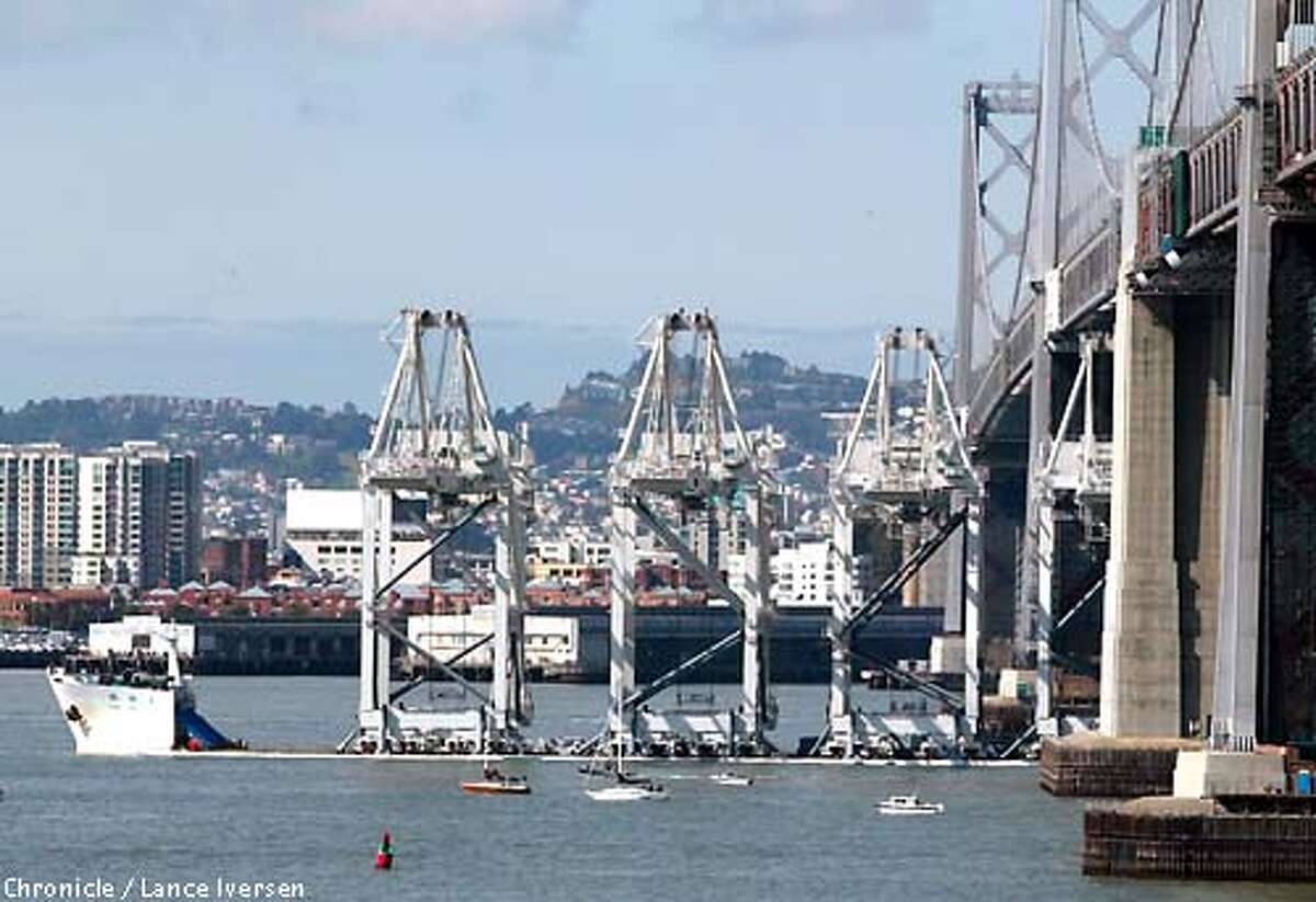 The Port of Oakland took shipment of four new cargo cranes that stand twenty two stories tall, but cleared the Bay Bridge by four feet. BY LANCE IVERSEN/SAN FRANCISCO CHRONICLE