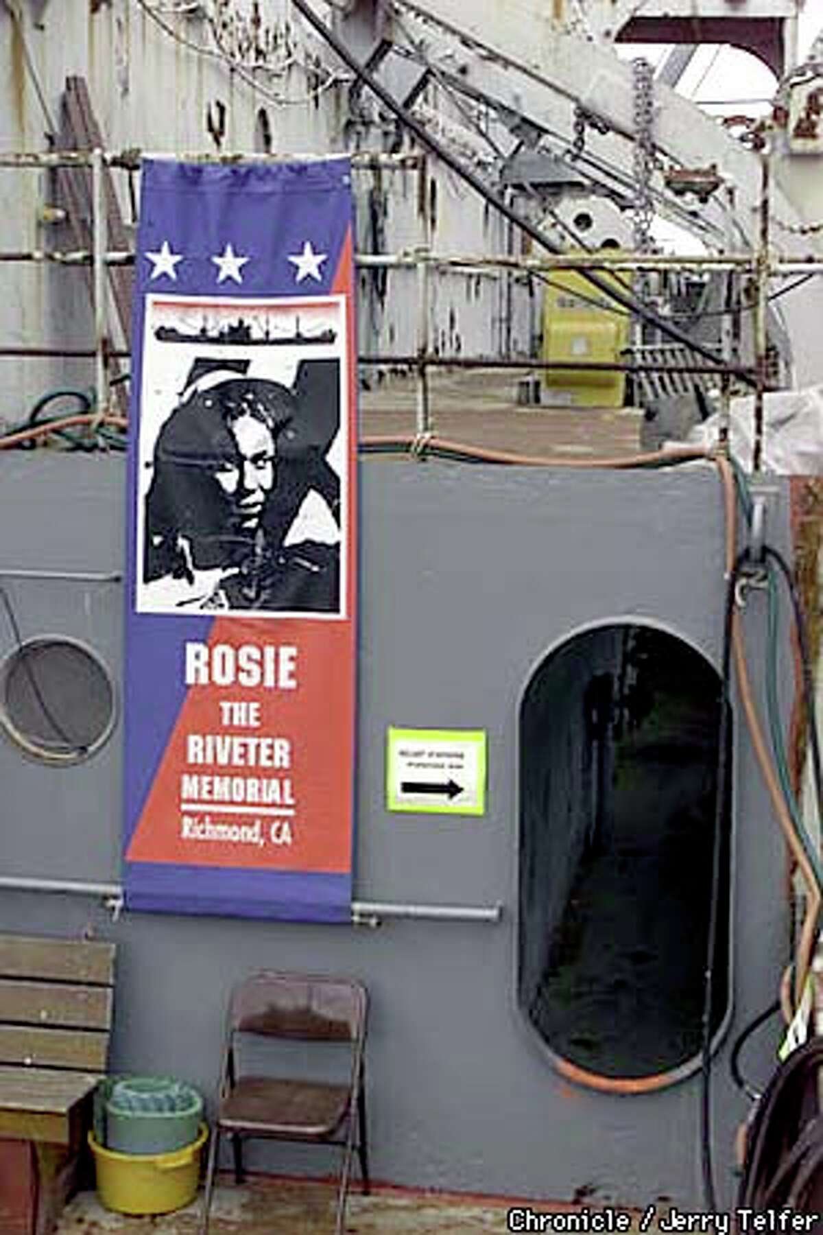 A poster on a World War II-era ship heralded the dedication of the Rosie the Riveter Memorial in Richmond. Chronicle photo by Jerry Telfer