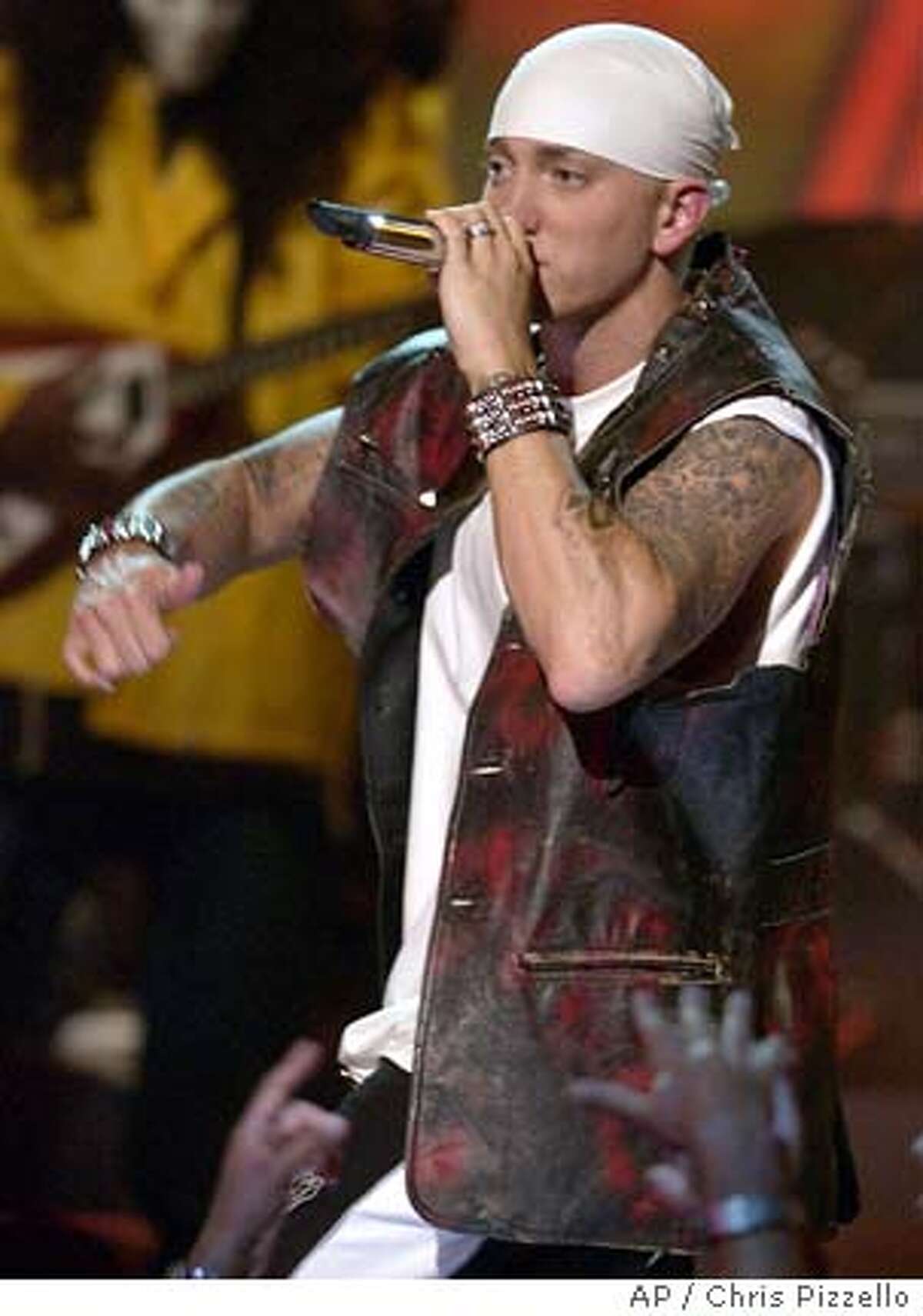 Eminem moons MTV; P. Diddy a fashion winner; 'ER' actress 'too old'