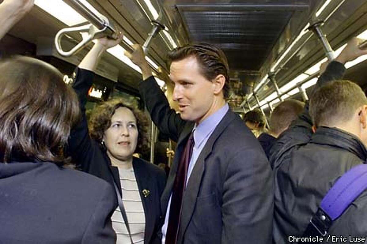 Supervisor Gavin Newsom chatted with constituents on the Muni. "The campaign needs some visibility, so people know I'm not ignoring them.'' Chronicle photo by Eric Luse