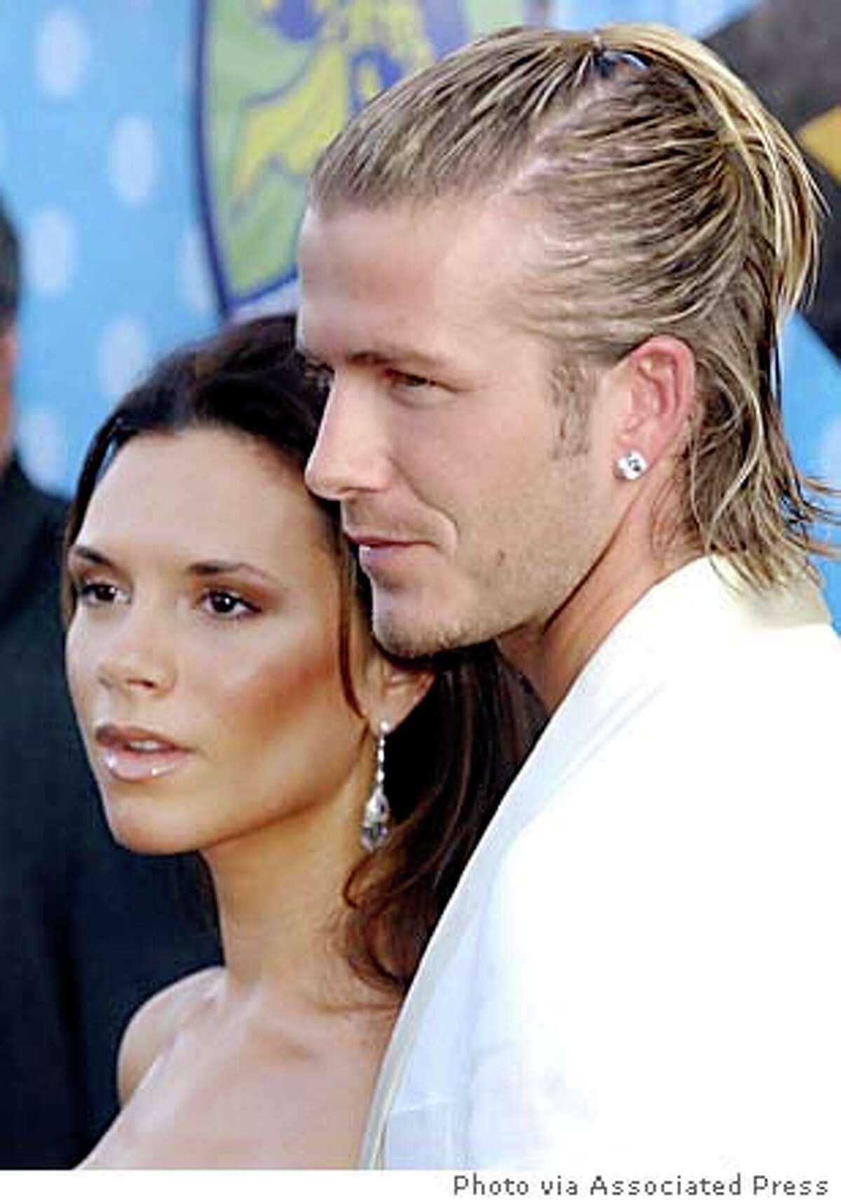 Victoria Beckham defends marriage; Marisa Tomei caught in gunfire ...