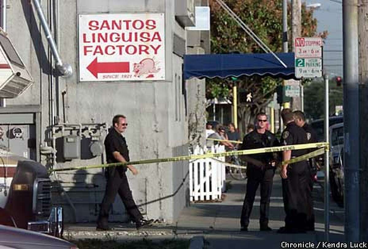 San Leandro police and FBI agents worked outside the Santos Linguisa Factory on Washington Avenue in San Leandro, where three government meat inspectors were killed. Chronicle photo by Kendra Luck