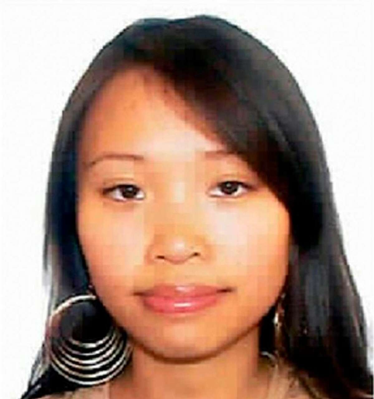 This composite photo release by New Haven Police Dept., shows Yale graduate student Annie Le in a video image entering 10 Amistad the morning of her disappearance on the campus at Yale University in new haven, Conn. Sept. 8, 2009. At left is an undated of Le. Police on Sunday said they found what they believe is the body of the graduate student and bride-to-be hidden inside the wall of 10 Amistad, a university building where she was last seen. (AP Photo/New Haven Police Dept.)